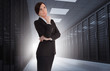 Businesswoman looking thoughtful in data center