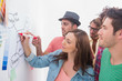 Photo: Creative team watching colleague add to flowchart Creative team watching colleague add to flowchart