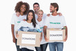 Foto: Happy group of volunteers holding clothes donation boxes Happy group of volunteers holding clothes donation boxes