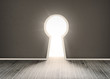 Door shaped keyhole showing bright light