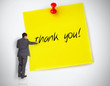 Photo: Businessman writing thank you on a giant post it Businessman writing thank you on a giant post it