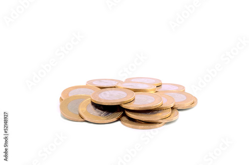 Photo: Pile of coins isolated on a white Pile of coins isolated on a white