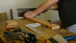 Luthier, craftsman or carpenter, cuts wood.