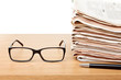Glasses and newspapers