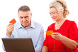 elderly couple doing online shopping.