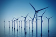 Floating wind turbines during hazy day.