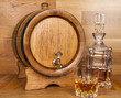 glass of whiskey, carafe and barrel