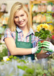 Woman holding a flower box while smiling
