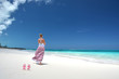 Girl on the desrt beach of Little Exuma, Bahamas