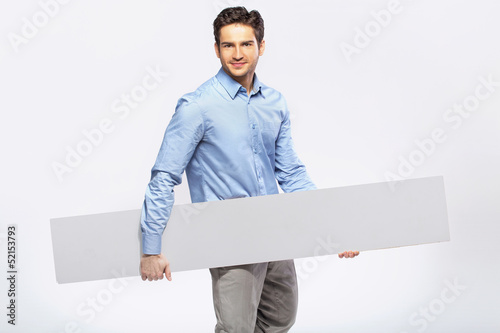 Photo: Picture of handsome man in suit with a blank board Picture of handsome man in suit with a blank board