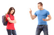 Angry brother pointing with finger and threatening