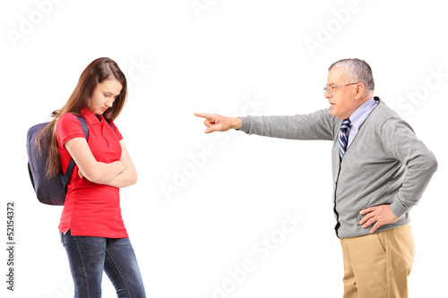 Photo: Angry grandfather shouting and pointing with his finger at his n Angry grandfather shouting and pointing with his finger at his n