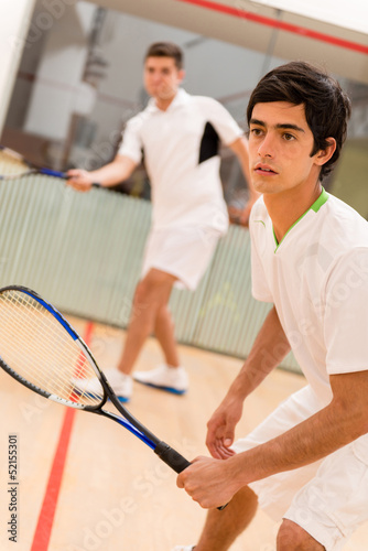 Photo: Males playing squash Males playing squash