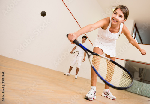 Photo: Woman playing squash Woman playing squash