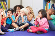 Group of Elementary Pupils In Classroom Touching Noses