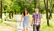 Young couple walking together in a park