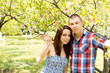 Young couple portrait embracing outdoors