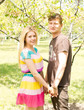 Young couple holding hands and smiling