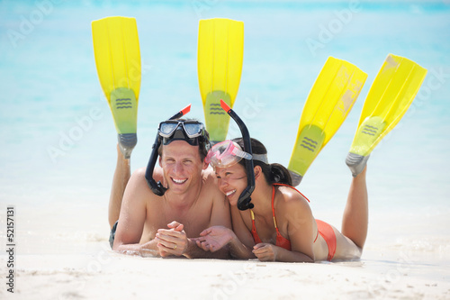 Photo: happy young couple have fun on beach happy young couple have fun on beach