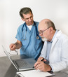 Two Senior Doctors at Laptop Conference