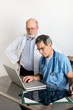 Photo: Two Senior Medical Doctors Discussing Patient's MRI Film Scans Two Senior Medical Doctors Discussing Patient's MRI Film Scans