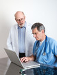 Photo: Senior Medical Doctors Discussing Patient's MRI Film Scans Senior Medical Doctors Discussing Patient's MRI Film Scans