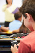 Photo: Pupil Sending Text Message On Mobile Phone In Class Pupil Sending Text Message On Mobile Phone In Class