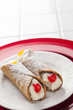 Two Tasty Cannoli on Plate