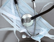 Photo: surgical mask and a stethoscope. The symbols of medicine. surgical mask and a stethoscope. The symbols of medicine.