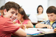 Photo: Pupils Studying At Desks In Classroom Pupils Studying At Desks In Classroom