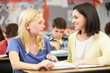 Photo: Teacher Reading With Female Pupil In Class Teacher Reading With Female Pupil In Class