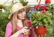 Photo: beautiful girl in a greenhouse beautiful girl in a greenhouse