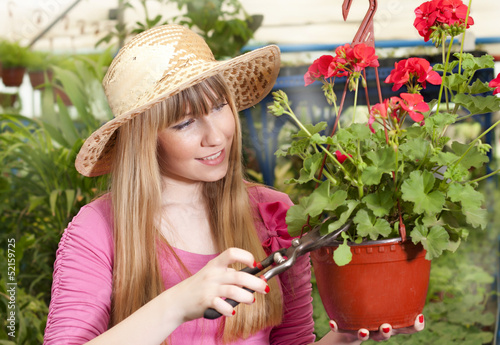Photo: beautiful girl in a greenhouse beautiful girl in a greenhouse