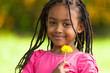 Outdoor portrait of a cute young black girl - African people
