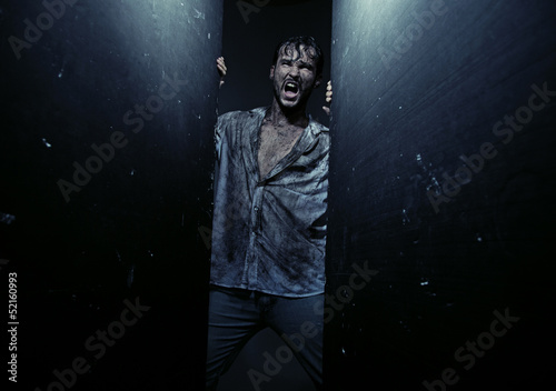 Photo: Dirty exhausted man during adventure Dirty exhausted man during adventure