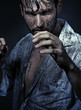Dirty handsome man prepareing to fight