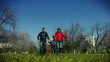 Happy family running in the park, slow motion