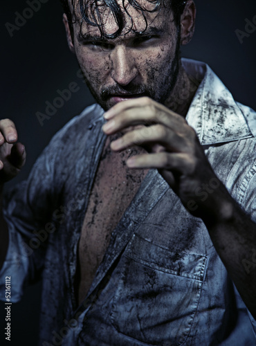 Photo: Dirty handsome man prepareing to fight Dirty handsome man prepareing to fight