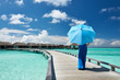 Woman on a beach jetty at Maldives