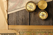 Antique compasses over old map