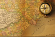 Foto: Antique compass over old XIX century map Antique compass over old XIX century map