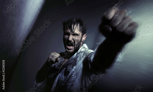 Photo: Dirty handsome man fighting for egsistance Dirty handsome man fighting for egsistance