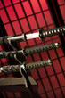 Drawn katana with other swords on red background