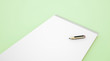 Sketch book with pencil on green
