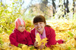 Photo: Mother and baby laying on maple leaves Mother and baby laying on maple leaves