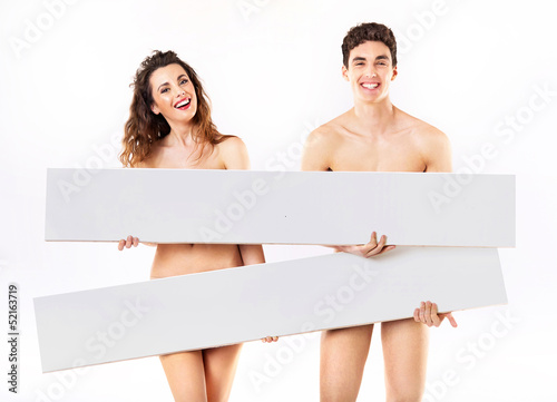 Photo: Laughing nude couple with empty adverts Laughing nude couple with empty adverts