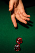 Playing dices on green table