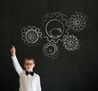 Boy with chalk turning gear cogs and running hamster