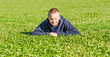 Pretty lying boy relax on the fresh grass