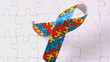 Autism ribbon falling onto jigsaw surface